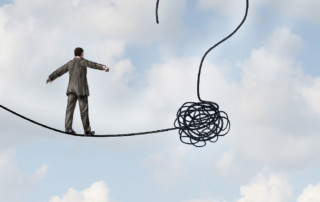Illustration of man walking on tight rope with a question mark ending.